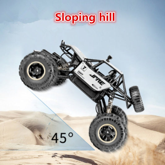 Black-and-white 1:16 remote-controlled off-road toy vehicle on oversized tires