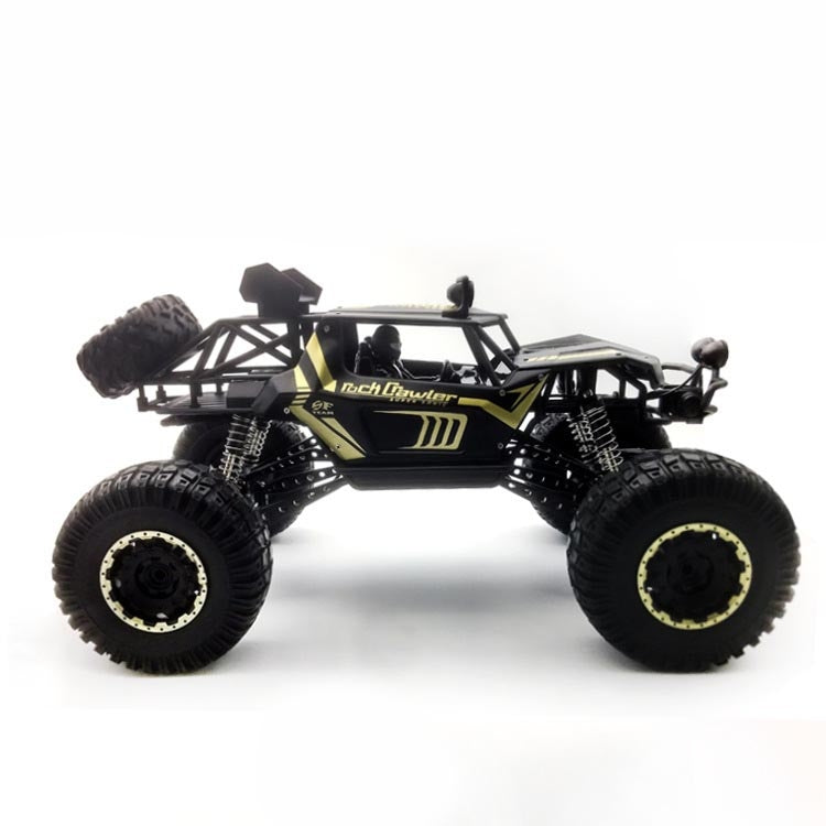 Black and gold RC off-road climbing truck toy with oversized knobby tires and roll cage