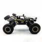 Black and gold RC off-road climbing truck toy, side view with large tread tires