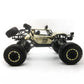 Black and gold RC off-road climbing truck toy with four large tires and front lights