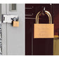 Copper padlock mounted on a door with tan body and engraved markings