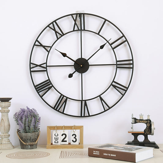 Round iron wall clock with Roman numeral-style ring and black hands, 80cm