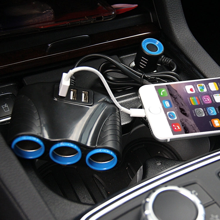 Car dashboard with black charger and three blue sockets, with a device plugged in