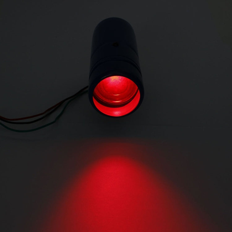 LED tachometer shift light glowing red with visible lens and cable attached