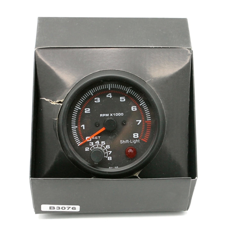 3.75-inch 12V car tachometer in retail box with RPM x1000 gauge visible