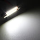 White LED license plate bulb beam shining on a dark surface, bright illumination