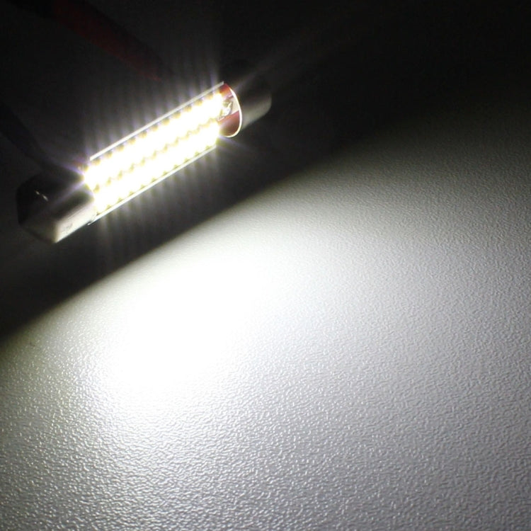 White LED license plate bulb beam shining on a dark surface, bright illumination
