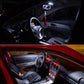 Vehicle at night showing bright lighting effect near the front area