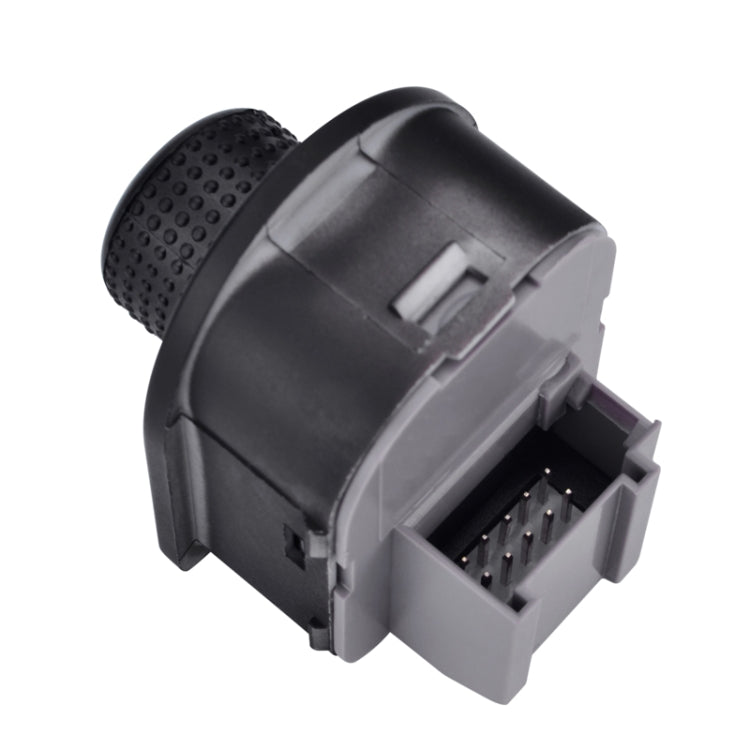 Rear mirror adjustment switch knob with exposed electrical connector pins on backside
