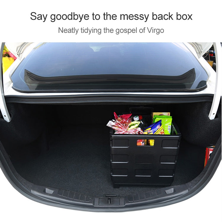 Black folding storage box with compartment panels holding packaged items in car trunk