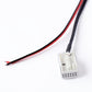 Car Bluetooth AUX adapter cable close-up with red/black wires and white plug