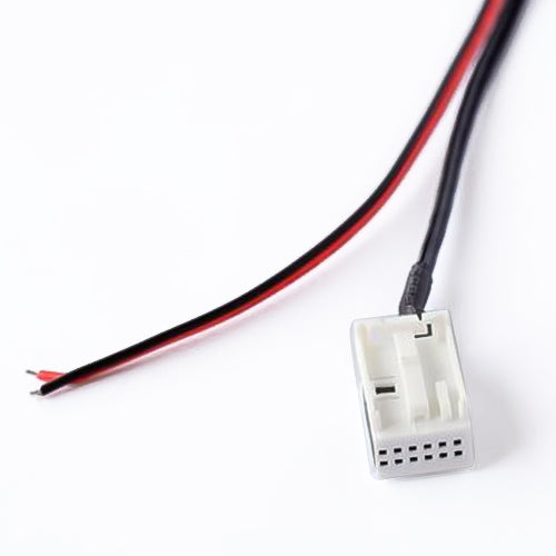 Car Bluetooth AUX adapter cable close-up with red/black wires and white plug