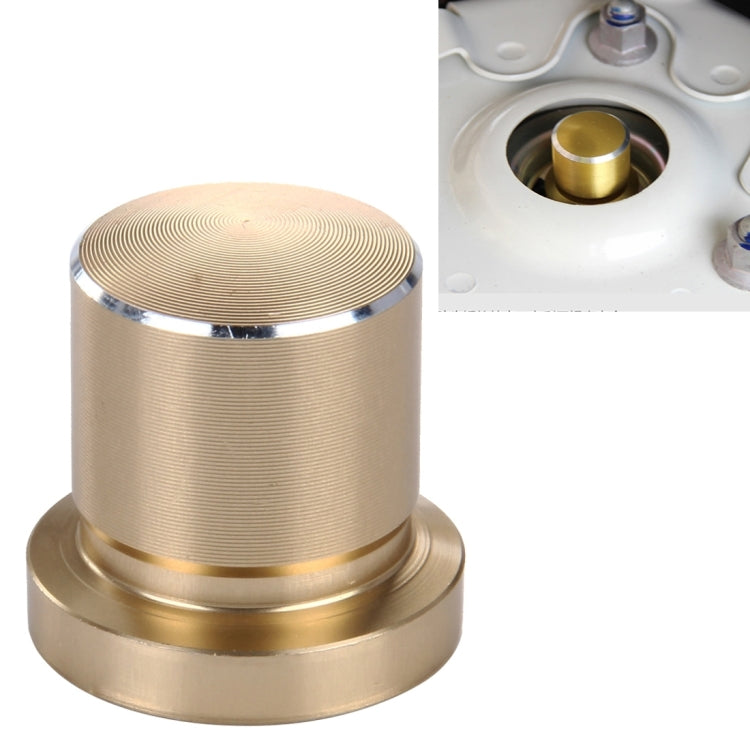 Gold metal bump stop screw cap with ridged top and chrome trim ring
