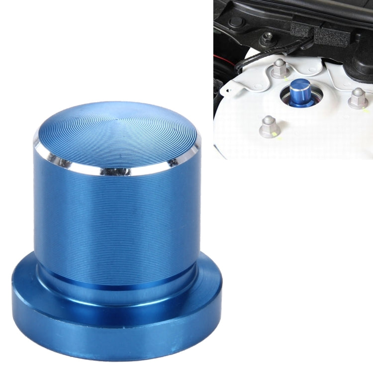 Blue metal bump stop screw cap with ridged top and silver trim ring