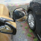 Black vehicle observation mirror mounted on fender with round convex lens