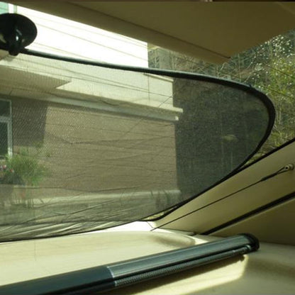 Foldable car window shade with black mesh and suction cups, stretched on rear glass