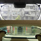 Rear car window shade stretched with suction cups on the glass