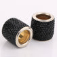 Set of black rhinestone crystal cylinders with gold inner rings and silver rims