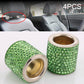 Set of green rhinestone crystal cylinders with gold inner rings and silver rims