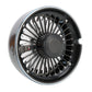 Silver-and-black portable car fan with front grille and central hub, side vented housing.