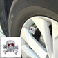 Silver skull tire valve cap cover with red eye accents for valve stems