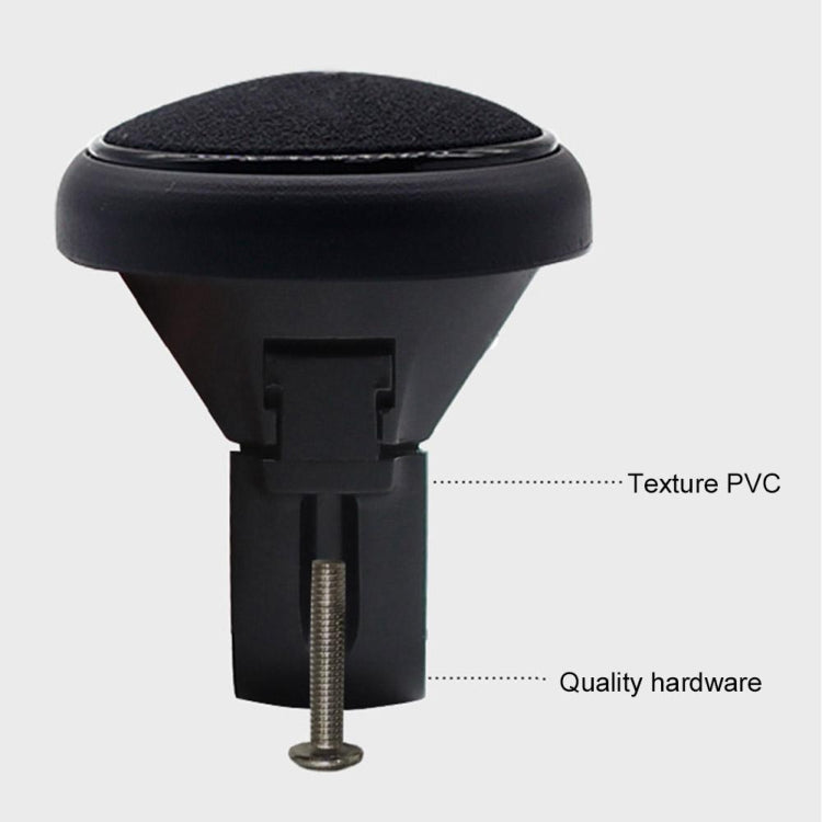 Black steering wheel auxiliary booster ball base with textured top and visible hardware