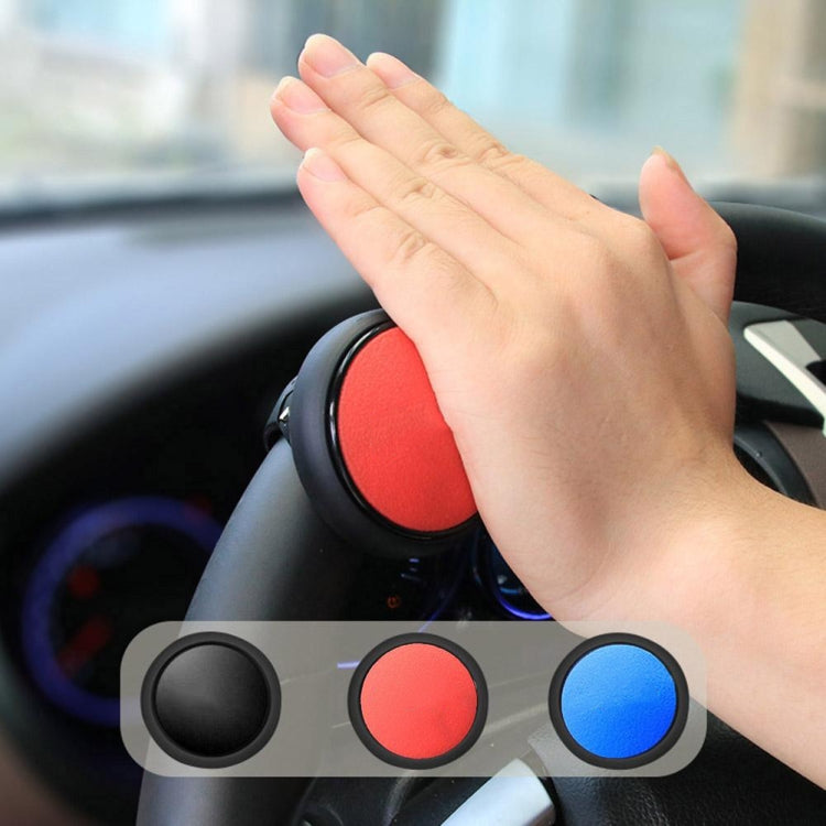 Red steering wheel auxiliary booster ball with hand placement on dashboard area