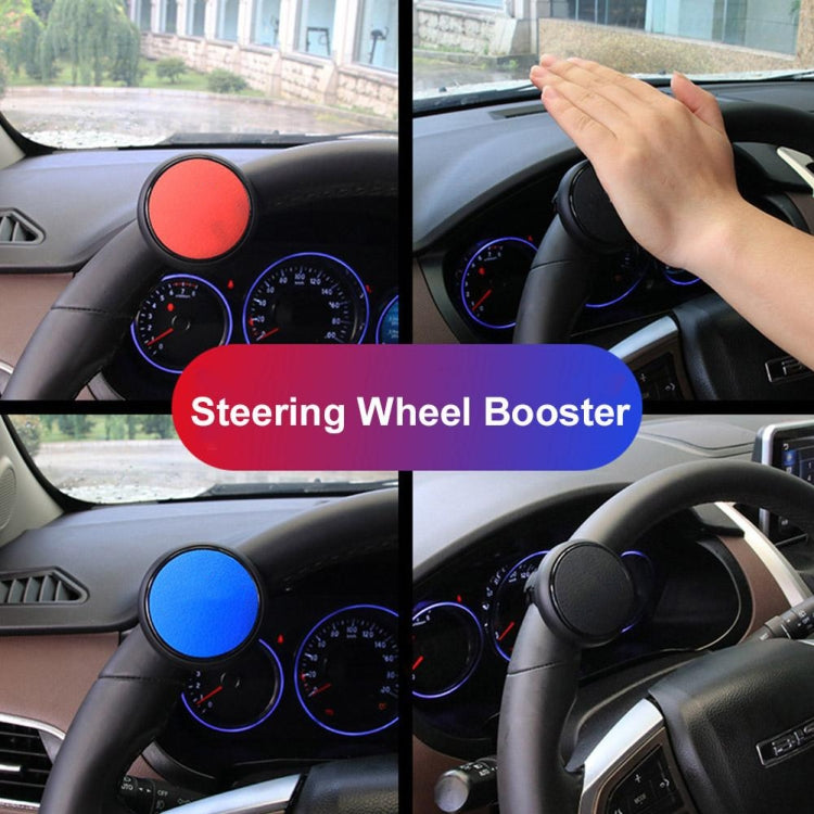 Red steering wheel auxiliary booster on dashboard with hand gripping wheel