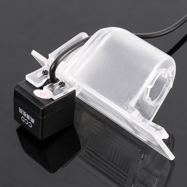 Car rear view backup camera with clear mounting cover and black connector module