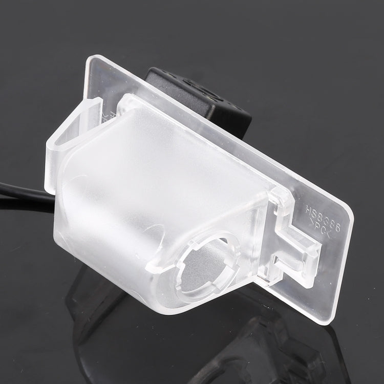 Car rear view backup camera with clear lens housing and side-mounted bracket