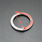Carbon fiber style trim ring with gray backing and red/blue edge accents