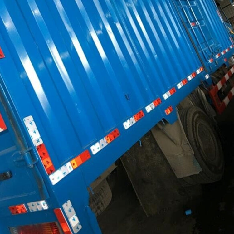 Red and white reflector strip accessories on blue container edge