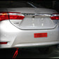 Red rear bumper reflector sign mounted on car trunk panel