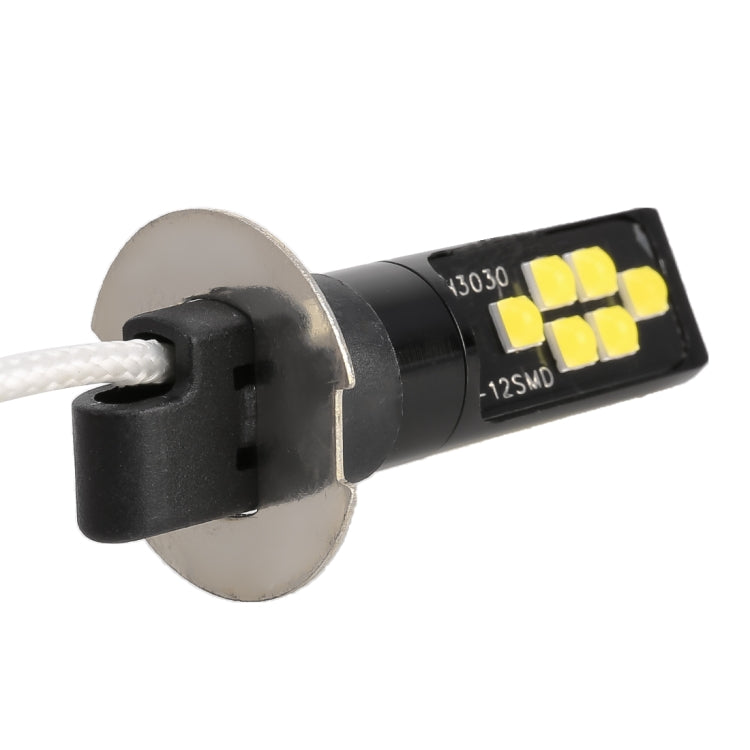 H3 LED fog light bulb close-up with round metal base and 12 SMD LED chips