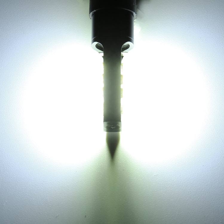 H3 LED fog light bulb installed, emitting a bright white beam from 12 SMD chips