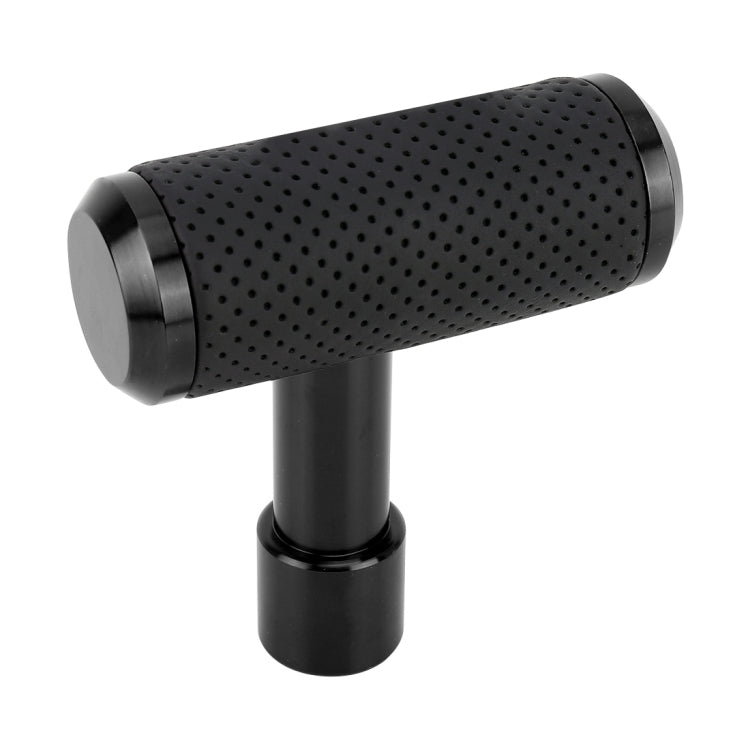 Black T-shaped gear shift knob with black perforated grip and dark metal base
