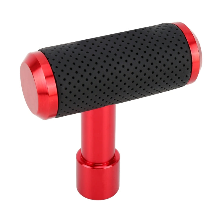 Red T-shaped gear shift knob with black perforated grip and red metal sleeves