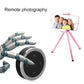 Circular Bluetooth remote controller with silver ring and media control buttons