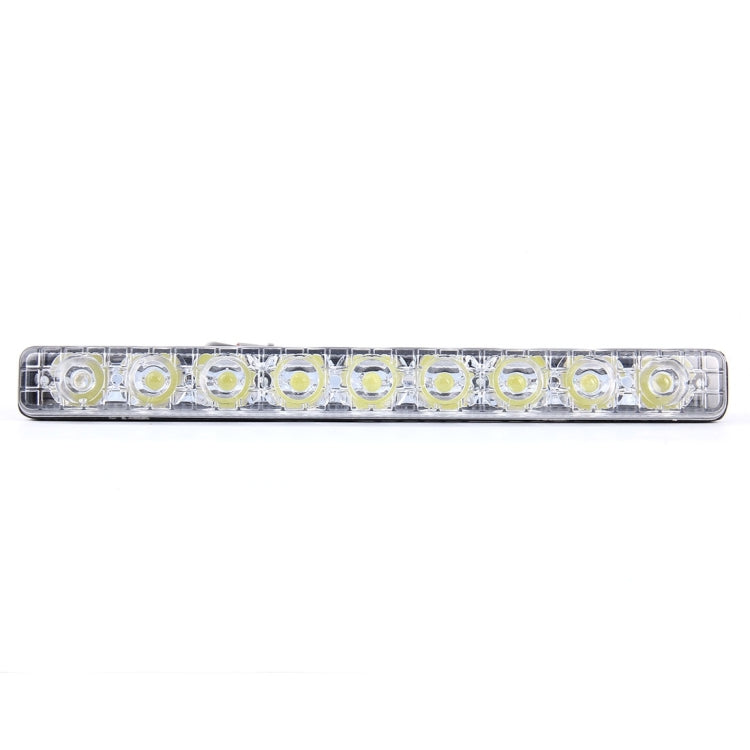 Long LED daytime running light bar with clear housing and circular white LED chips