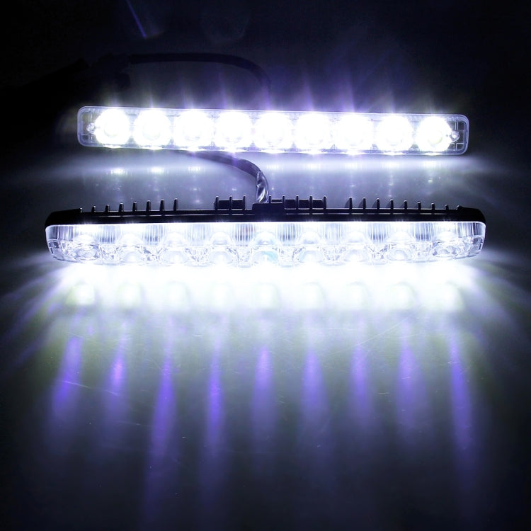 Two LED daytime running light bars glowing bright white in dark setting