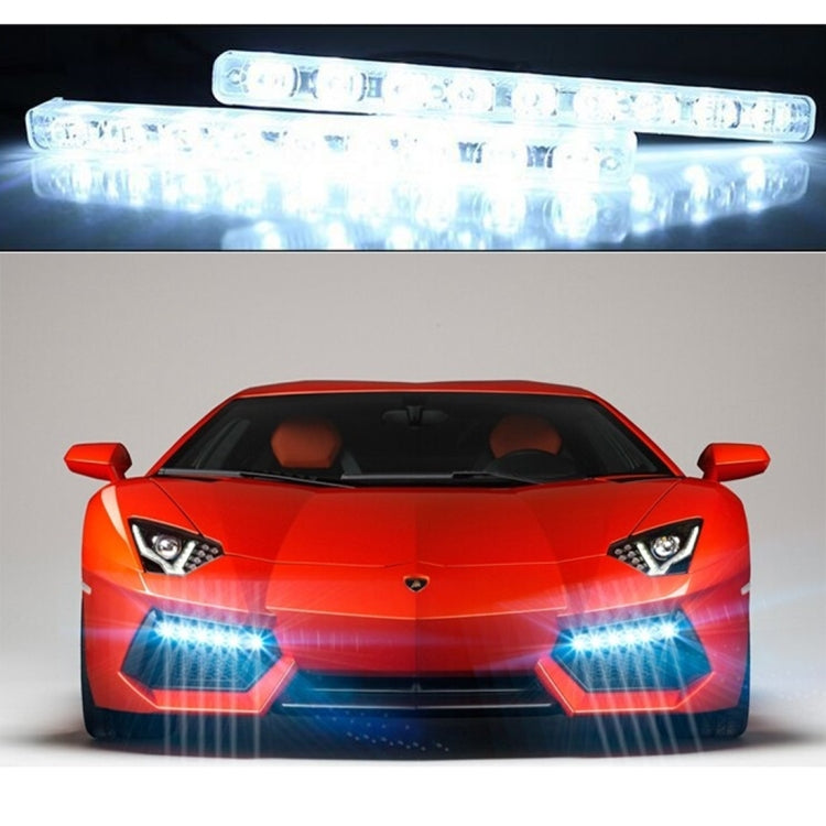 Car front with two LED daytime running light bars emitting bright white light