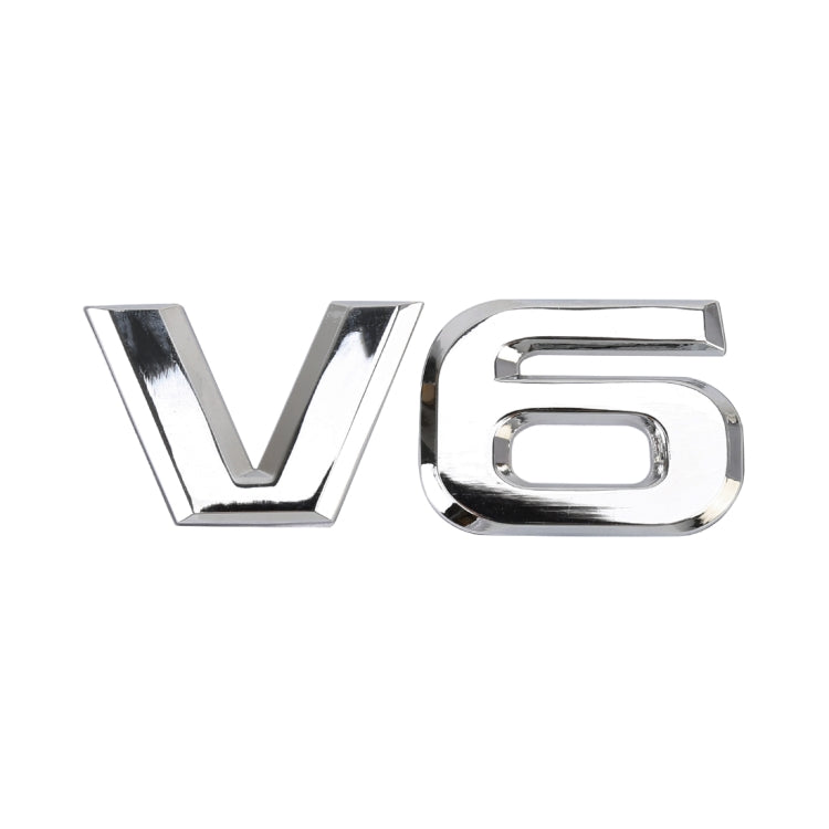 Silver V6 metal emblem sticker, close-up on plain background