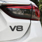 V8 emblem sticker on car rear panel, matte black metal letters