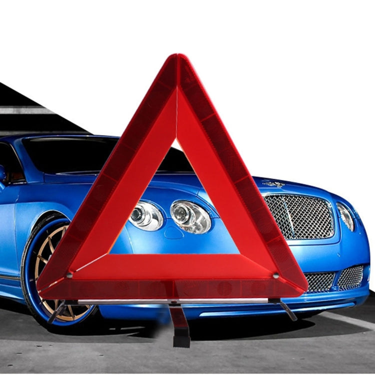 Red reflective warning triangle with fold-out legs and metal stake base