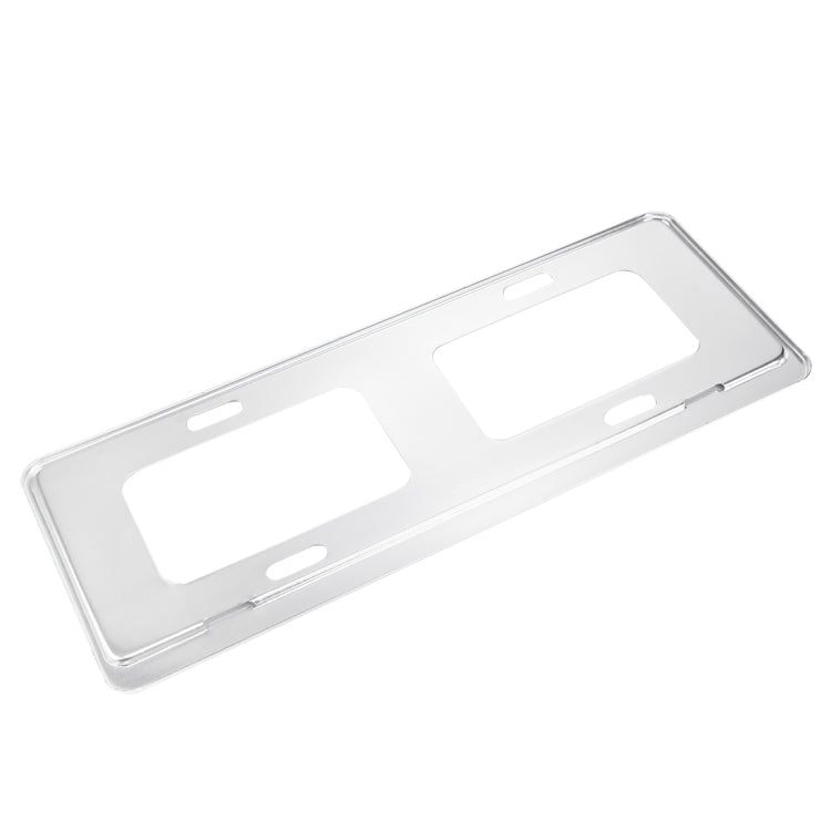 Silver license plate frame holder bracket with rectangular cutouts and corner mounting slots
