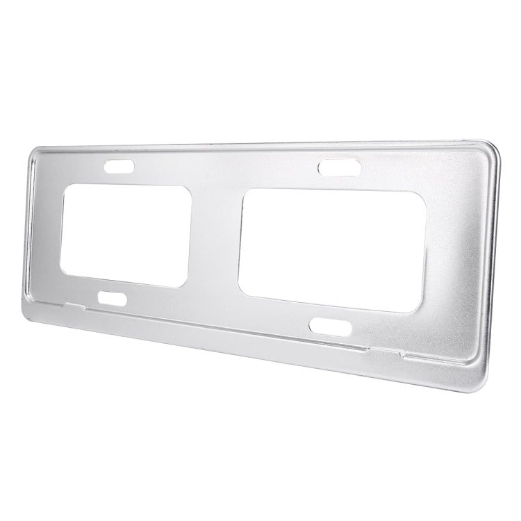 Silver license plate frame holder bracket, rectangular cutouts with mounting holes