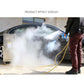 Black steam washer water spray gun producing mist during cleaning