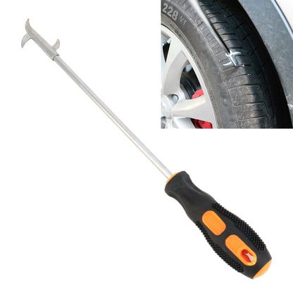 Black and orange tire cleaning hook tool with gripped handle and metal fork prongs
