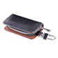 Black leather-texture zipper key wallet with orange-brown lining and key clip