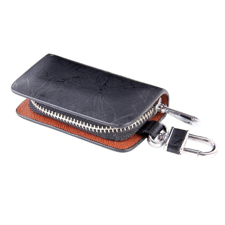 Black leather-texture zipper key wallet with orange-brown lining and key clip